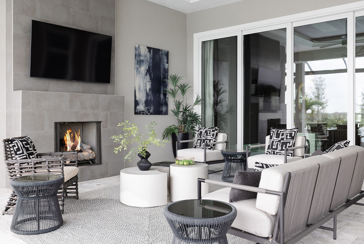 Sterling III Model in The Lake Club / Sarasota, FL / Lanai and Fireplace by Pizzazz Interiors